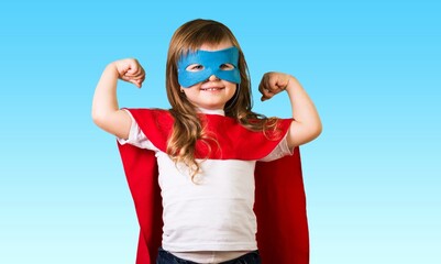 Content superhero kid in mask demonstrating power