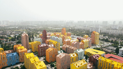 Aerial cityscape view of modern residential area with colour buildings