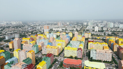 Aerial cityscape view of modern residential area with colour buildings