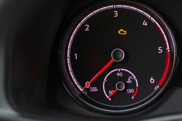 soft focus. natural light. the dashboard. the indicator is lit, the engine error is a check. there...