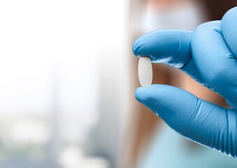 Medical oral capsules, antiviral drug of covid 19 concept in doctors hand.