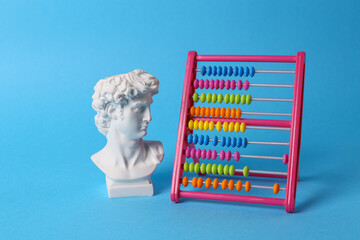 Antique David bust with abacus on blue background. Conceptual pop. Minimal still life. Creative idea - obrazy, fototapety, plakaty