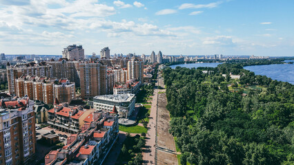 Area with residential buildings, waterfront, pedestrian and park area. Cityscape