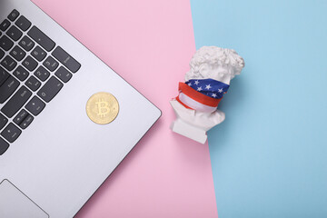 David bust with usa flag on his face, bitcoin and laptop on pink blue background. Minimal still...