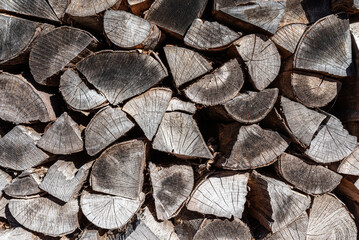 stack of seasoned split firewood, wood background