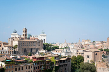 Obraz premium View of the city of Rome on a beautiful sunny day. Cityscape with architecture, church towers and old buildings. Photo taken in Rome, Italy.