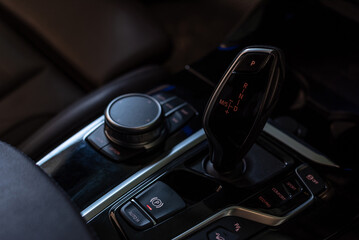 Automatic gear stick of a modern car, Control buttons. Car interior details.;