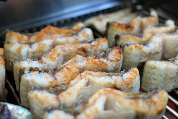 The eel, which is trimmed to a good size to eat, is being baked golden.