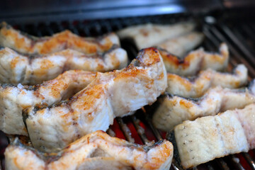 The eel, which is trimmed to a good size to eat, is being baked golden.