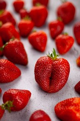 Strawberries on the table top view. Red berries pattern. Strawberry crop. Food still life in the spotlight. Red berry background. Still life.