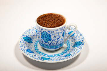 Turkish Coffee Cup - Coffee in a patterned cup isolated on a white background