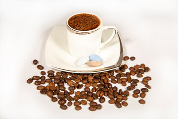 Coffee cup and beans on a white background. Space for text.