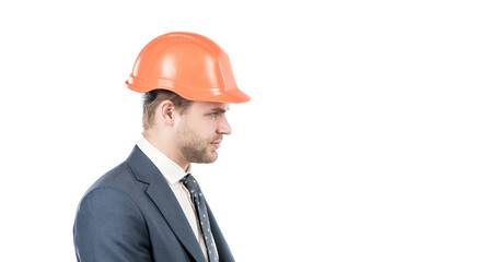 Engineering. Engineer side-face isolated on white. Serious engineer in hardhat. Profile portrait