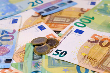 Euro banknotes and euro coins. Accounting concept. Close up view