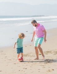 small kid and dad running on beach in summer vacation with ball, parenting