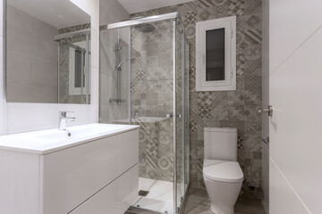 Small bathroom with geometric tiles