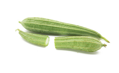 Angled luffa or Ridge gourd slice over on white background