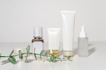 moisturizing cream bottle over leaf background studio, packing and skincare beauty concept