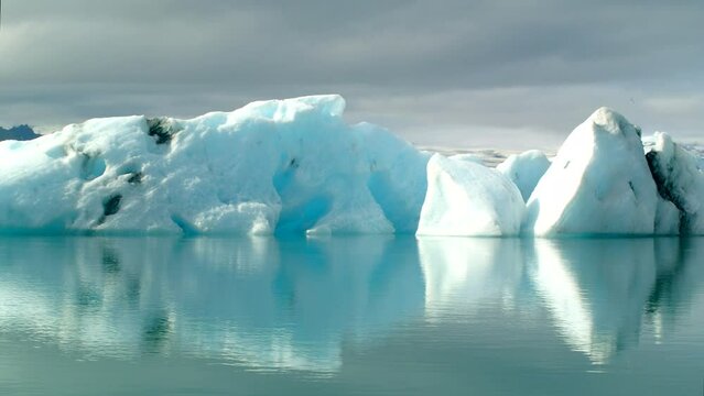 Icebergs floating in the Jokulsarlon glacier lagoon in South Central Iceland time lapse clip.
