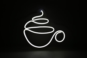 Trendy style. White mug of tea or coffee neon sign on background. Neon sign. Custom neon. Decor....