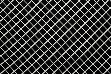 Background from fabric in a cage. Checkered material close up