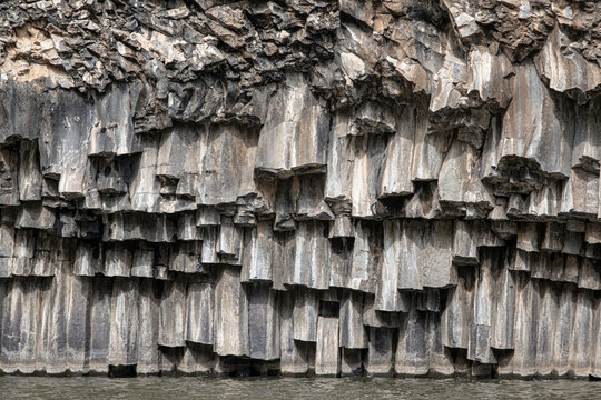 Vew of the hexagonal basalt columns in the Hexagon [Meshushim] Pool, a natural pool by Meshushim Stream in Yehudia Forest Nature Reserve, in central Golan Heights, Israel	