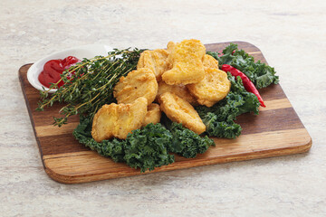 Crispy chicken nuggets with tomato ketchup