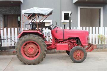old red tractor in the compound