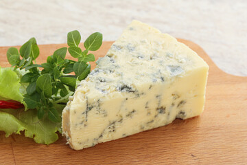 Blue cheese piece over board