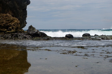 Fototapeta na wymiar Sea water crashing on the rocks on the coast (part 5)