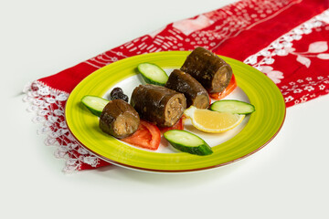 Stuff Egg Plant with salad in a dish isolated on colorful table cloth top view on grey background