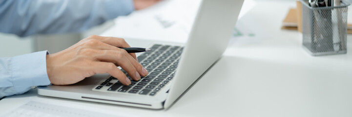 Business Professional Accountant Woman working on laptop computer making research for planning startup at desktop working process in office