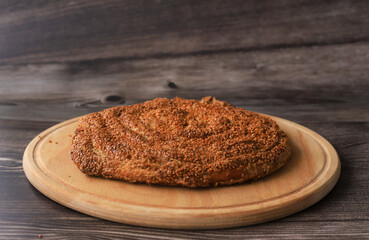 Sweet tahini roll cake, table top stock footage . Still life of delicious fresh tahini bun on round...