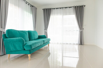 Green sofa in living room interior home background