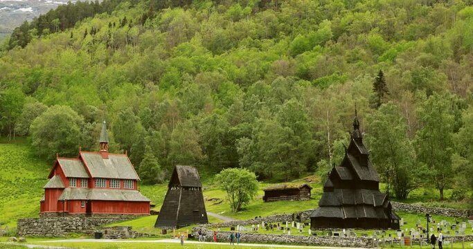 Borgund, Norway. People Walking Near Famous Norwegian Landmark Stavkirke An Old Wooden Triple Nave Stave Church In Summer Day. time lapse, timelapse, time-lapse,