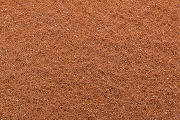 The texture of sponge scourer with copper addition. Brown fiber scrubber