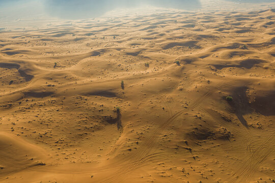 Aerial view of sand dunes in the desert at sunset, Male, Dubai, United Arab Emirates.