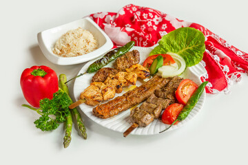 in a dish isolated on colorful table cloth top view on grey background