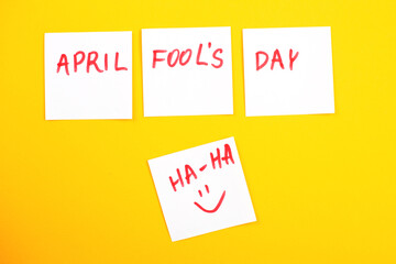 stickers with smiley and inscription april fools day on yellow background.