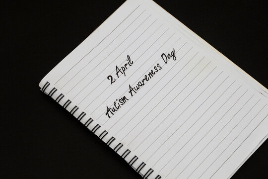 2April Autism Awareness Day written on notebook
