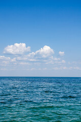 Picturesque seascape background. Sky with clouds and blue sea