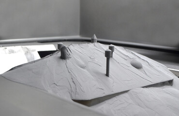 Surface with printed objects on metal 3D printer, covered metal powder inside of metal 3D printer....