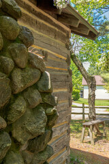 Old fashioned log cabin with stone fireplace