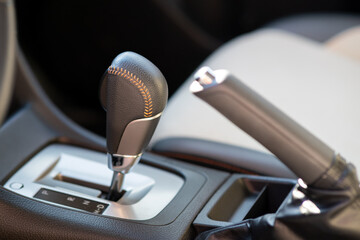 Closeup of car automatic transmission gear stick. Detail of vehicle interior