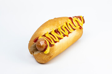Hot dog with ketchup and mustard on white isolated background.