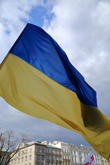 Flag of Ukraien waves agaisnt sky