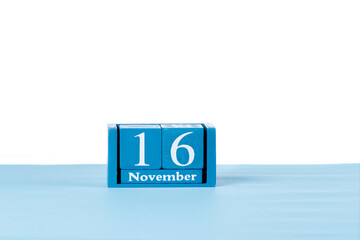 Wooden calendar November 16 on a white background