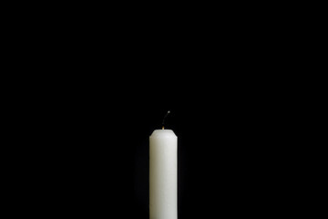 candle. extinguished candle on a black background