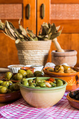 Different varieties and dressings of olives.