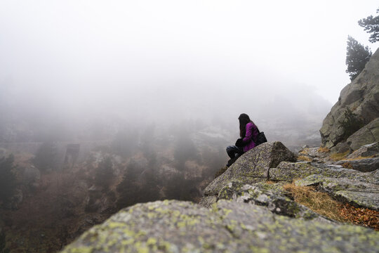 Anonymous woman on edge of cliff